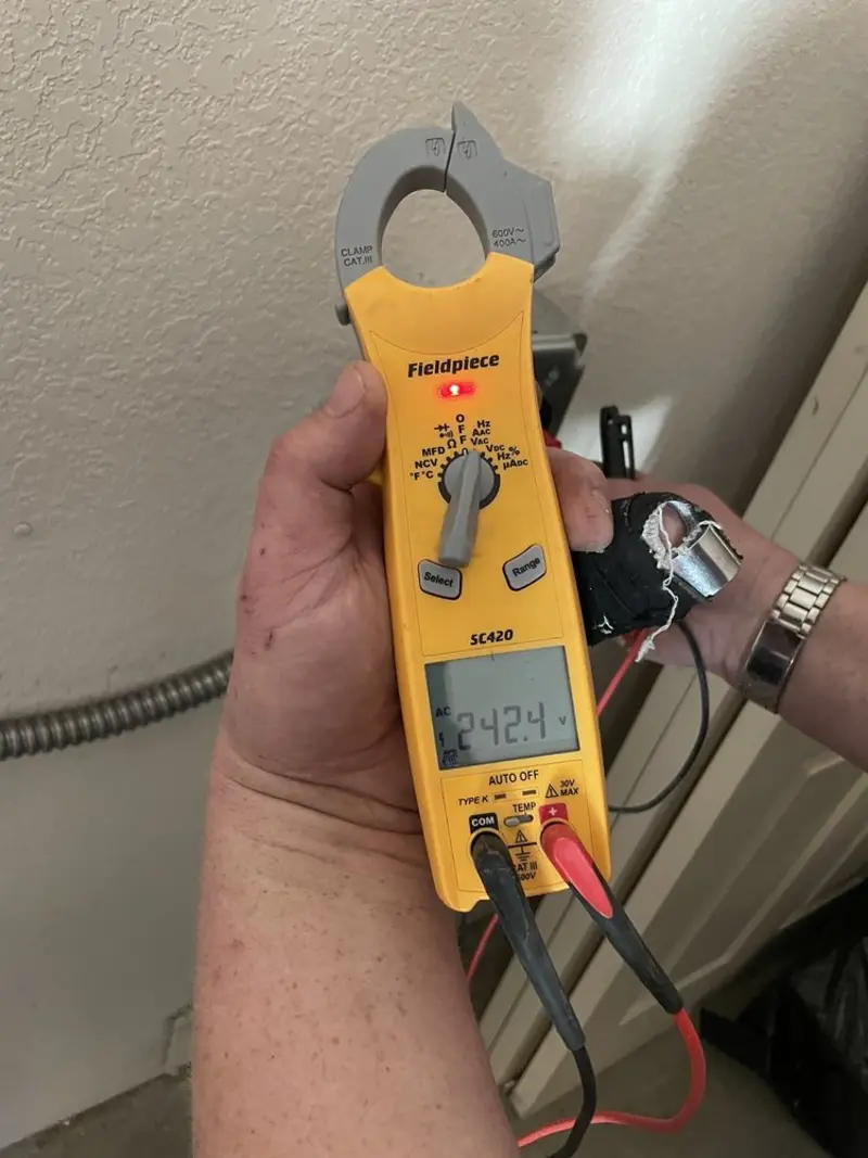 Voltage testing with clamp meter during Outlet Installation in Norfolk